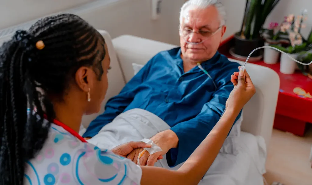 Medical worker drawing blood from patient