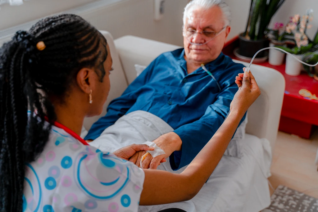 Man receiving an IV, featured image for Blog Post The Cost Saving Power of Generic Equivalents